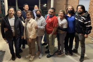 Picture of the 14 cleaning workers who spoke out at the school board meeting