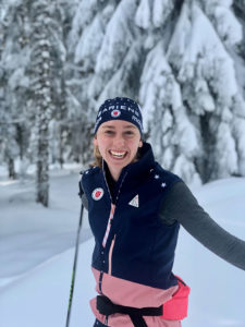 Picture of Lucy in skiing gear outdoors in the snow